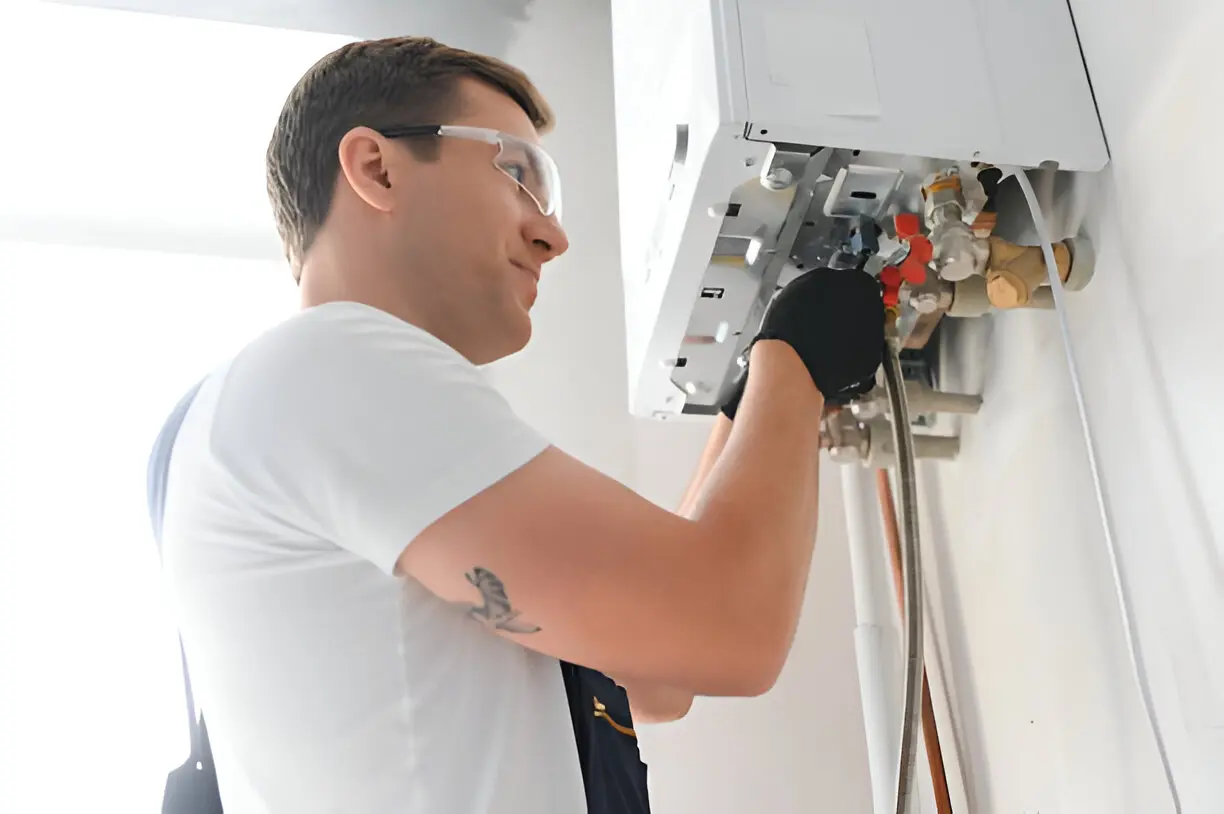 Technician inspecting a heating system in a residential property in Los Angeles, CA